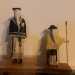 Si tratta di sculture in legno in miniatura che riproducono la figura dei confratelli incappucciati che conducono la processione